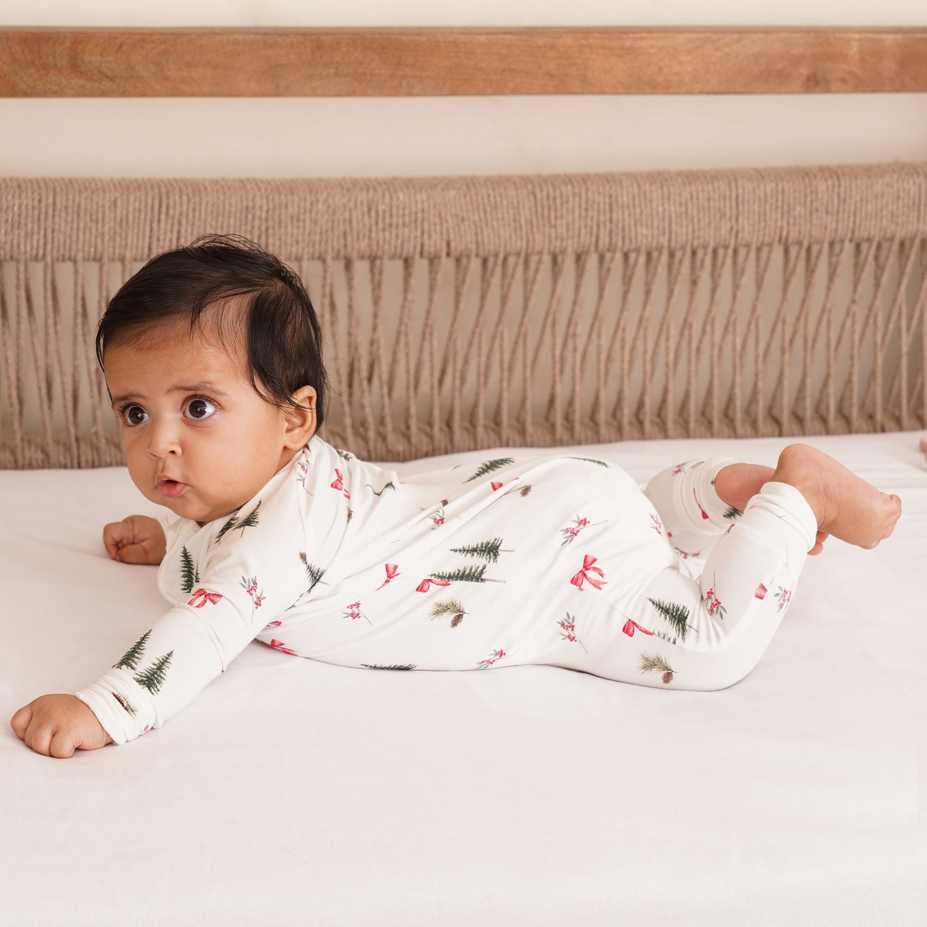 baby in a bamboo zipsuit in festive spirit