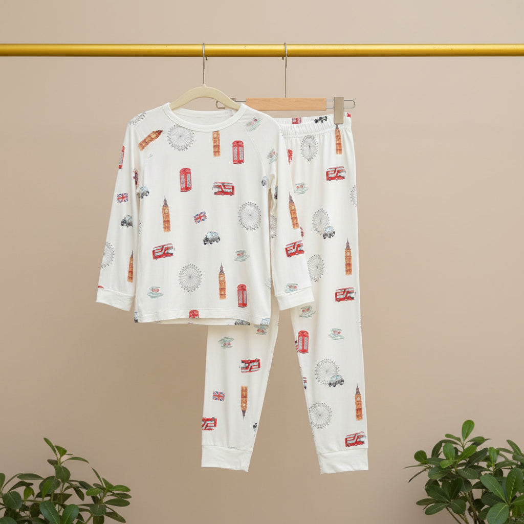 Children's pajama set with vehicle pattern on a beige background