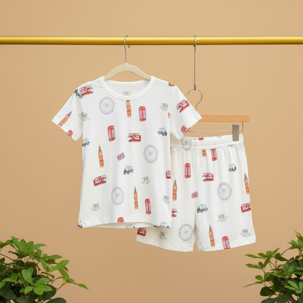 Children's t-shirt and shorts set with London-themed print on a beige background