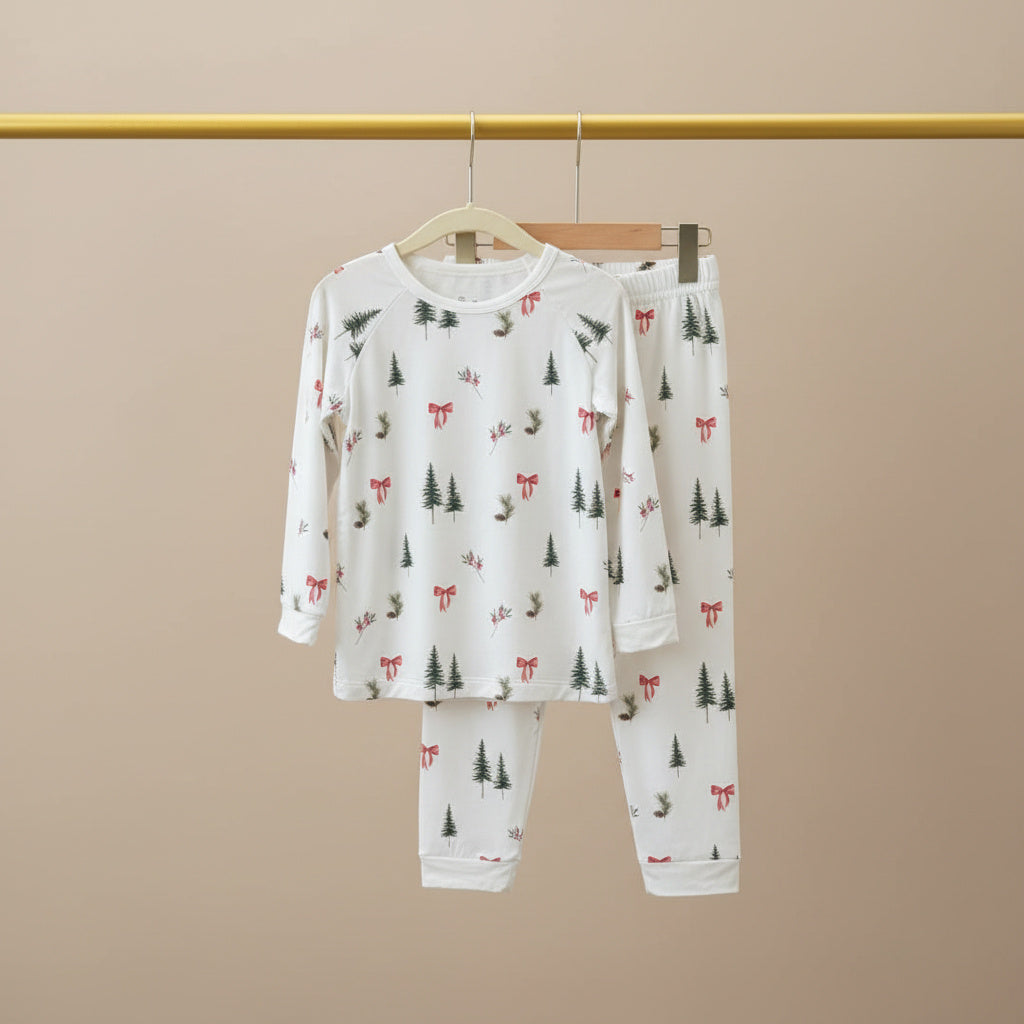 Children's pajama set with forest pattern on a beige background